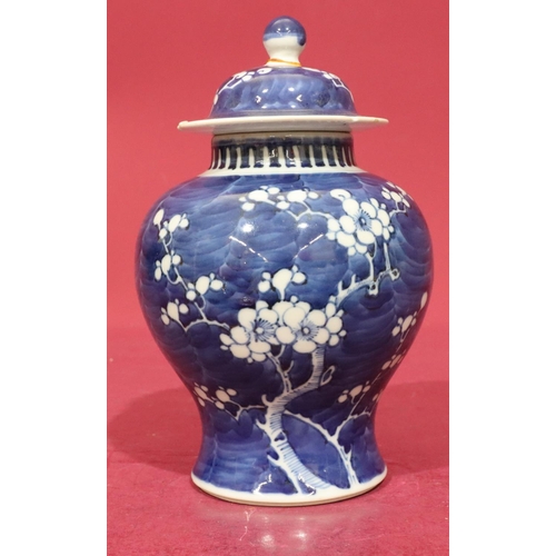 66 - A Chinese 19th/20th Century round bulbous thin neck ginger jar with cover on blue and white ground w... 