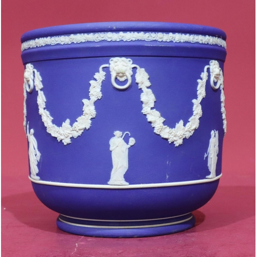 72 - A Wedgwood Jasperware round jardinière with raised classical figure, lion ring, grapevine and swag d... 