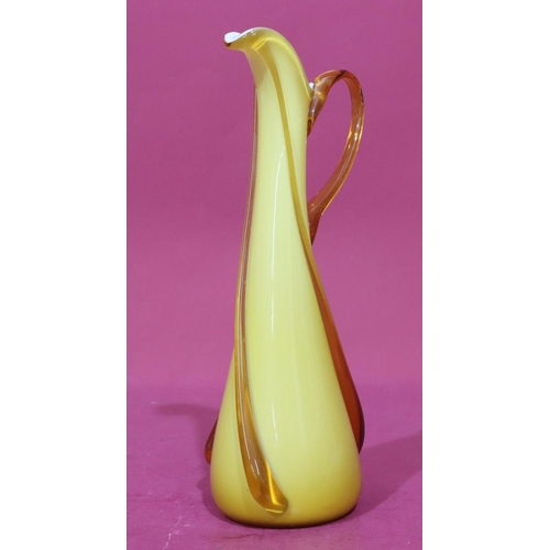 78 - An ochre coloured glass tall jug, 37cm high