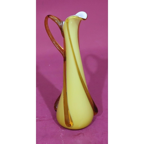 78 - An ochre coloured glass tall jug, 37cm high