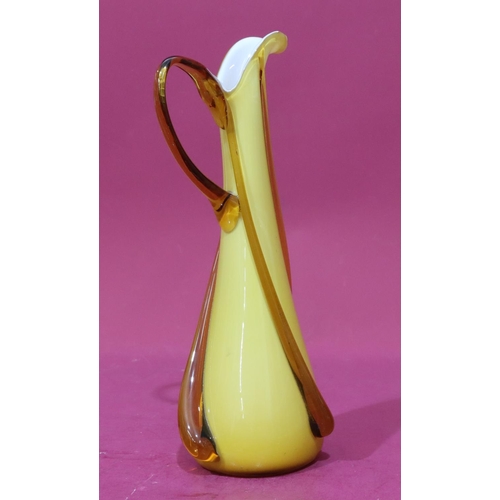 78 - An ochre coloured glass tall jug, 37cm high