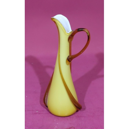 78 - An ochre coloured glass tall jug, 37cm high