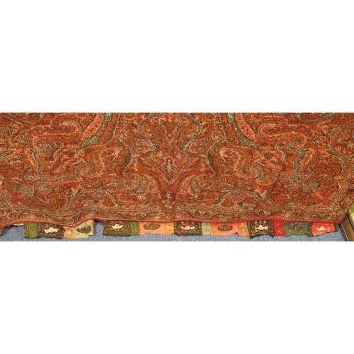 784 - A Persian style woven throw with hand embroidered ends, 324cm x 155cm