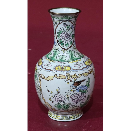 810 - A 20th Century cloisonné small round bulbous trumpet shaped vase on white ground with multicoloured ... 