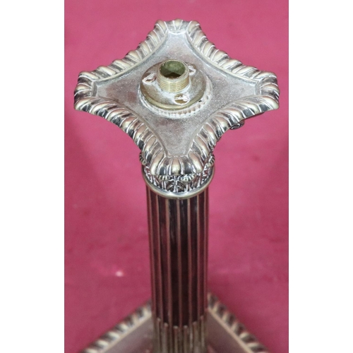 825 - A silver plated corinthian column table lamp on square base (no fitments), 23cm high