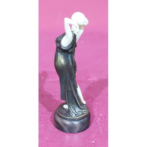 845 - A reproduction Art Deco style figure of a half naked lady on round base, 22cm high