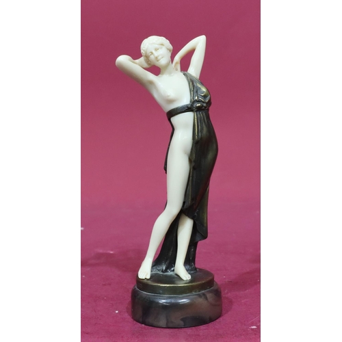 845 - A reproduction Art Deco style figure of a half naked lady on round base, 22cm high