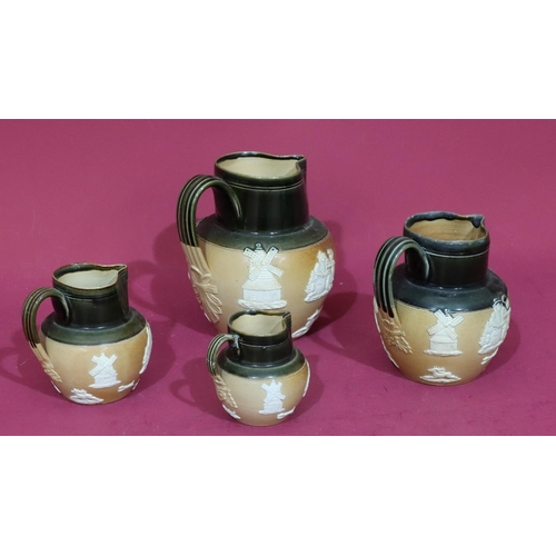 85 - A set of 4 Royal Doulton glazed earthenware round bulbous graduated jugs on brown and green ground w... 