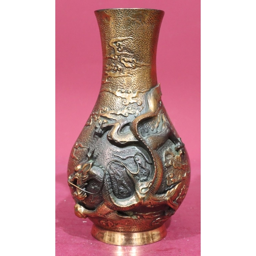 850 - A heavy copper bronze round bulbous thin neck vase with raised dragon motif, 29.5cm high