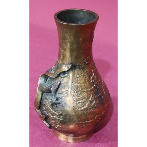 850 - A heavy copper bronze round bulbous thin neck vase with raised dragon motif, 29.5cm high