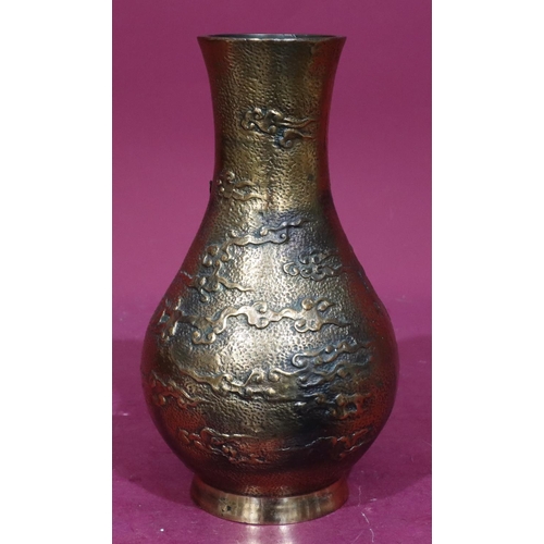 850 - A heavy copper bronze round bulbous thin neck vase with raised dragon motif, 29.5cm high