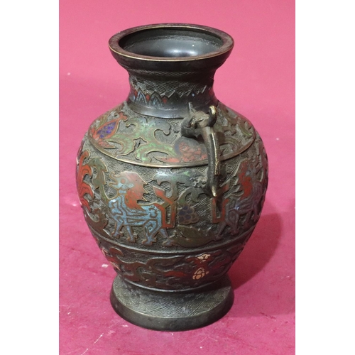 851 - An Oriental bronze round bulbous thin neck trumped shaped 2-handled vase with part enamelled decorat... 