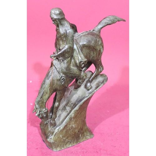 852 - A Remington style bronze figure of a Red Indian on horseback riding down slope, 46cm high