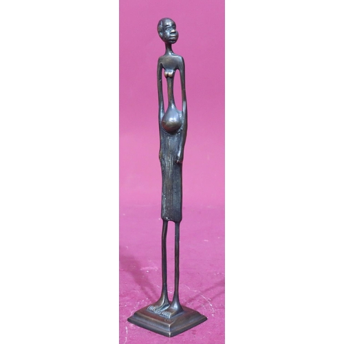 854 - A bronze figure of an African lady on square base, 30.5cm high