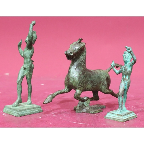 855 - A bronze figure of a galloping horse, 2 similar green bronze figures of standing gentleman on square... 