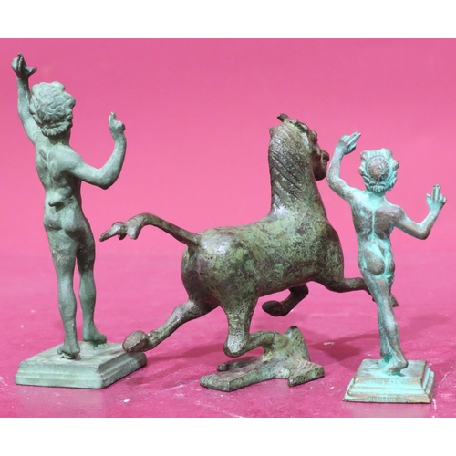 855 - A bronze figure of a galloping horse, 2 similar green bronze figures of standing gentleman on square... 