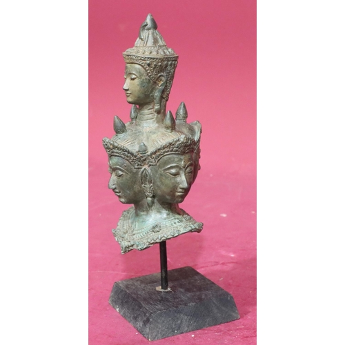 871 - An Eastern bronze bust of 5 figureheads on later wooden base, 29cm high