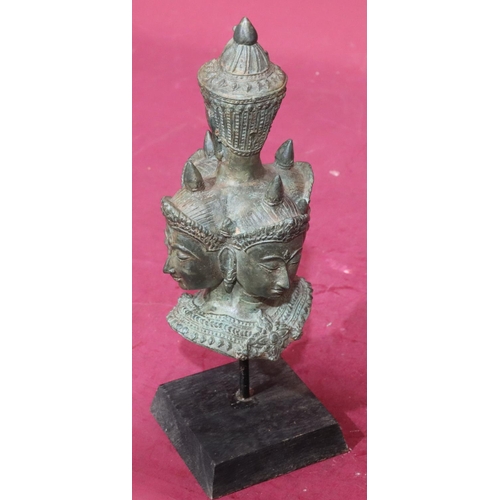 871 - An Eastern bronze bust of 5 figureheads on later wooden base, 29cm high