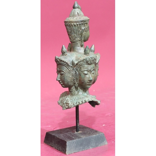 871 - An Eastern bronze bust of 5 figureheads on later wooden base, 29cm high