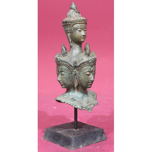 871 - An Eastern bronze bust of 5 figureheads on later wooden base, 29cm high