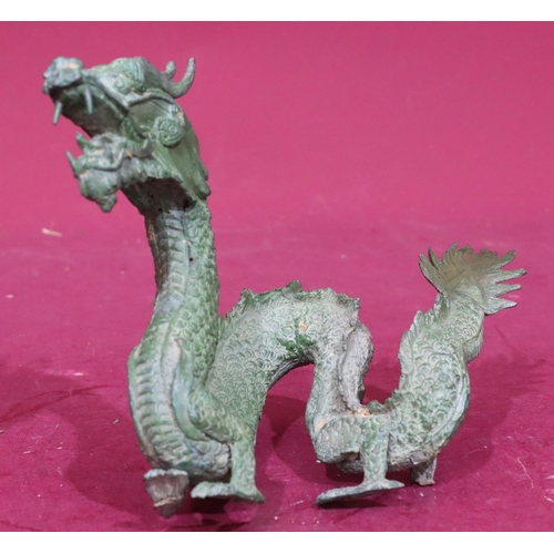 872 - A green bronze figure of a dragon, 24.5cm wide, 16cm high