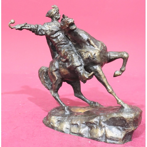 886 - A bronze group of figure on horseback, 24.5cm high