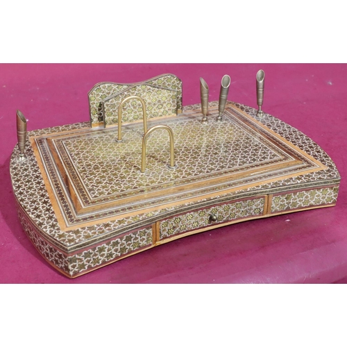 887 - An Eastern style lacquered rectangular shaped desk stand with single drawer mounted with stationery ... 