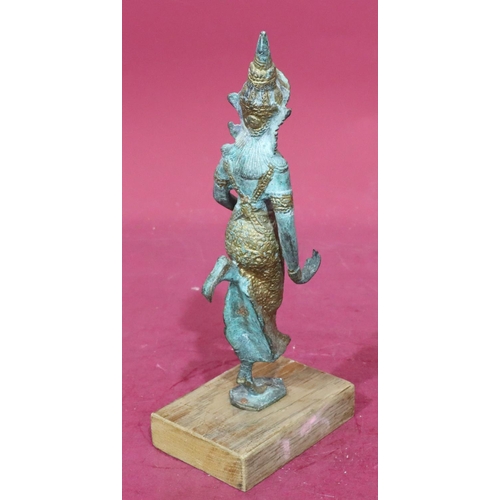 891 - An Eastern bronze and gilt figure of a lady dancer mounted on later wooden base, 30cm high without b... 