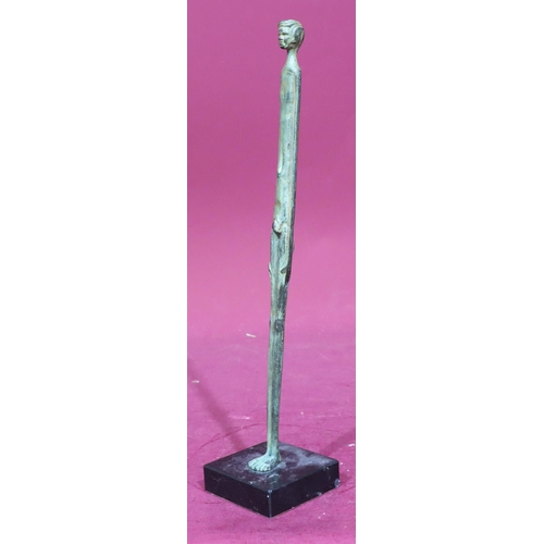 892 - A tall narrow bronze figure of a naked gentleman on square base, 39cm high