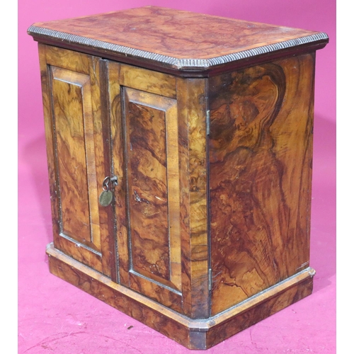 899 - A Victorian burr walnut table top coin collector's cabinet with banded decoration, 2 panel doors enc... 