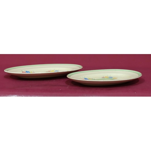 90 - 2 Clarice Cliff oval graduated meat plates on white and green ground with crocus pattern decoration,... 