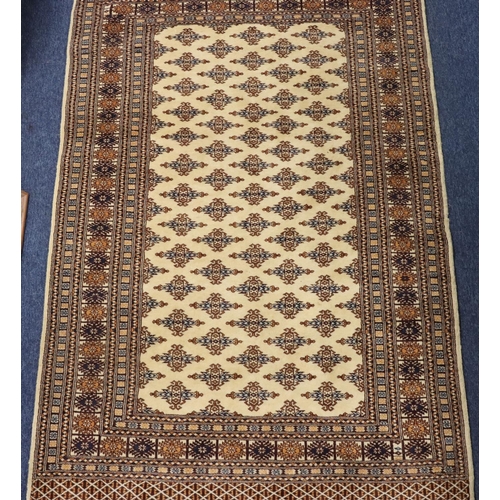 903 - A modern Persian rug on cream, blue and brown ground with allover medallions, 188cm x125cm