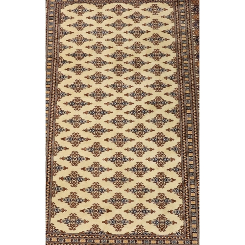 903 - A modern Persian rug on cream, blue and brown ground with allover medallions, 188cm x125cm