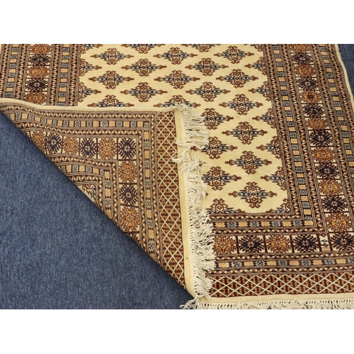 903 - A modern Persian rug on cream, blue and brown ground with allover medallions, 188cm x125cm