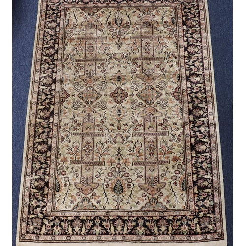 904 - A Persian silk rug on cream and blue ground with multicoloured medallion, floral and leaf decoration... 