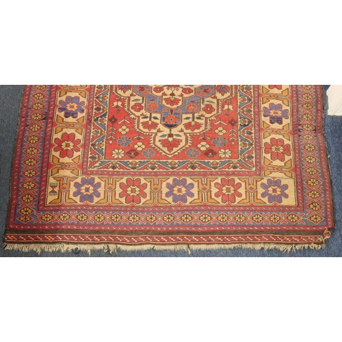 906 - A Kilim style rug on red, blue and cream ground with centre medallion and allover floral motifs, 220... 