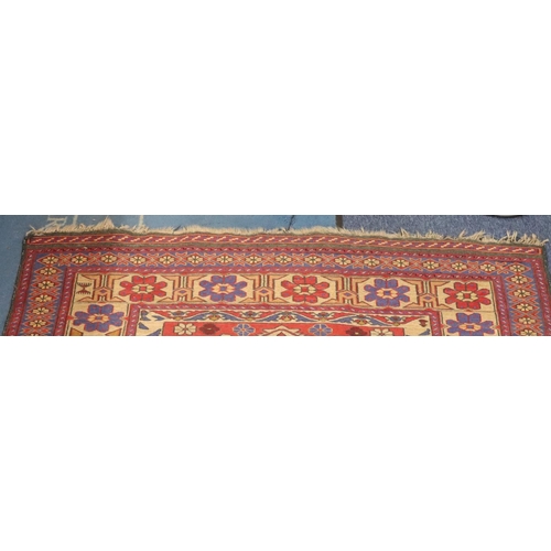 906 - A Kilim style rug on red, blue and cream ground with centre medallion and allover floral motifs, 220... 