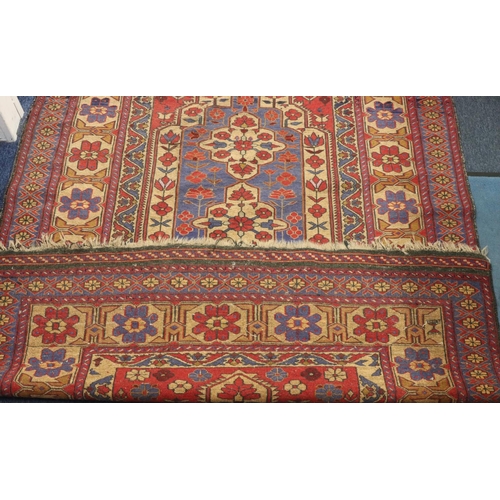 906 - A Kilim style rug on red, blue and cream ground with centre medallion and allover floral motifs, 220... 