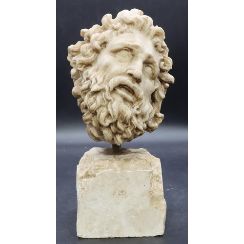 907 - A continental classical figurehead, of a gentleman, on spike mounted on stone base 30cm high.