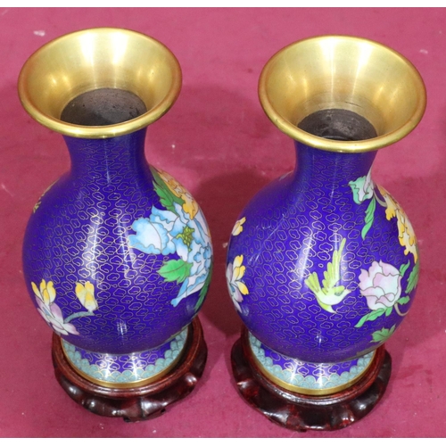 911 - A pair of 20th Century cloisonné round bulbous thin neck trumped shaped vases on blue ground with mu... 