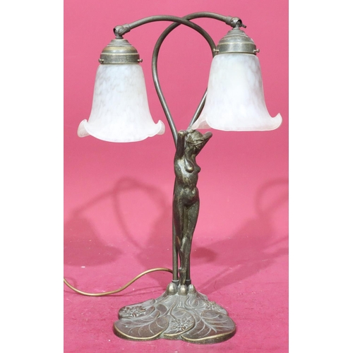 912 - A reproduction gilt metal table lamp in the form of a full length standing female nude with 2 glass ... 