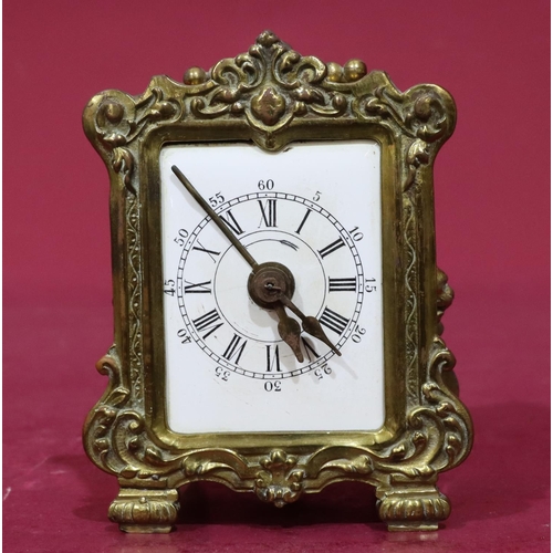 916 - A Continental gilt metal alarm repeat clock with white enamel dial, Roman and Arabic numerals, centr... 