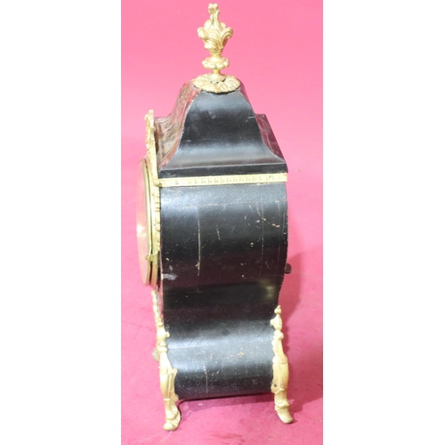 917 - An ebonised and boulle mantel clock with allover raised gilt metal shell, leaf and scroll decoration... 