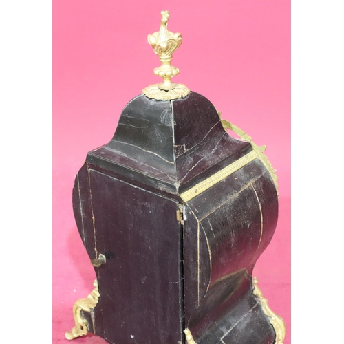 917 - An ebonised and boulle mantel clock with allover raised gilt metal shell, leaf and scroll decoration... 