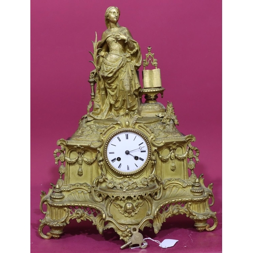 928 - A gilt Spelter 8-day striking mantel clock with raised female figure motif to top, allover raised sw... 