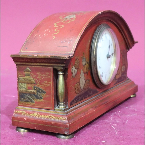 929 - A red chinoiserie timepiece with arched top and allover gilt figure, tree, floral and scroll decorat... 