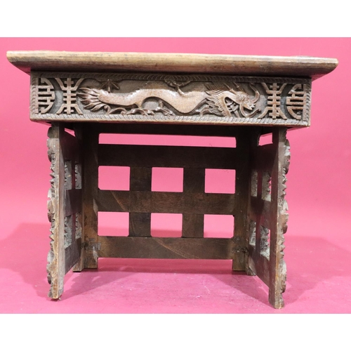 934 - A carved Oriental small rectangular shaped coffee table on 3 collapsible legs, allover carved dragon... 