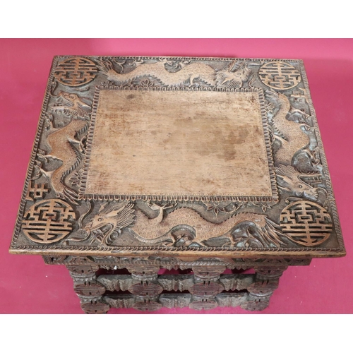 934 - A carved Oriental small rectangular shaped coffee table on 3 collapsible legs, allover carved dragon... 