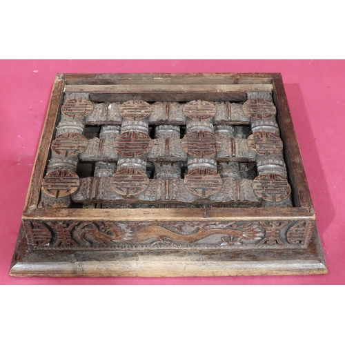 934 - A carved Oriental small rectangular shaped coffee table on 3 collapsible legs, allover carved dragon... 