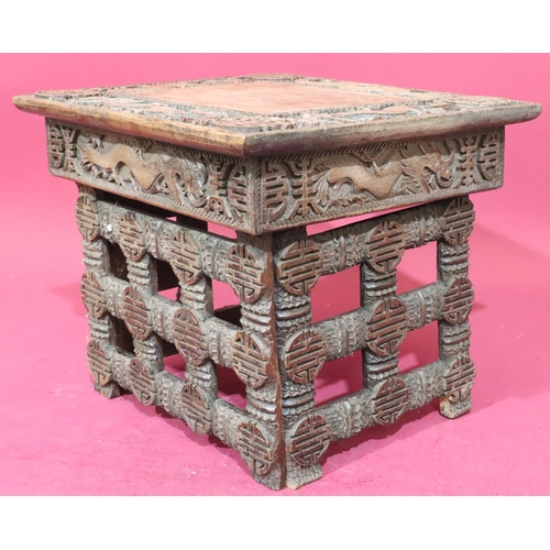 934 - A carved Oriental small rectangular shaped coffee table on 3 collapsible legs, allover carved dragon... 